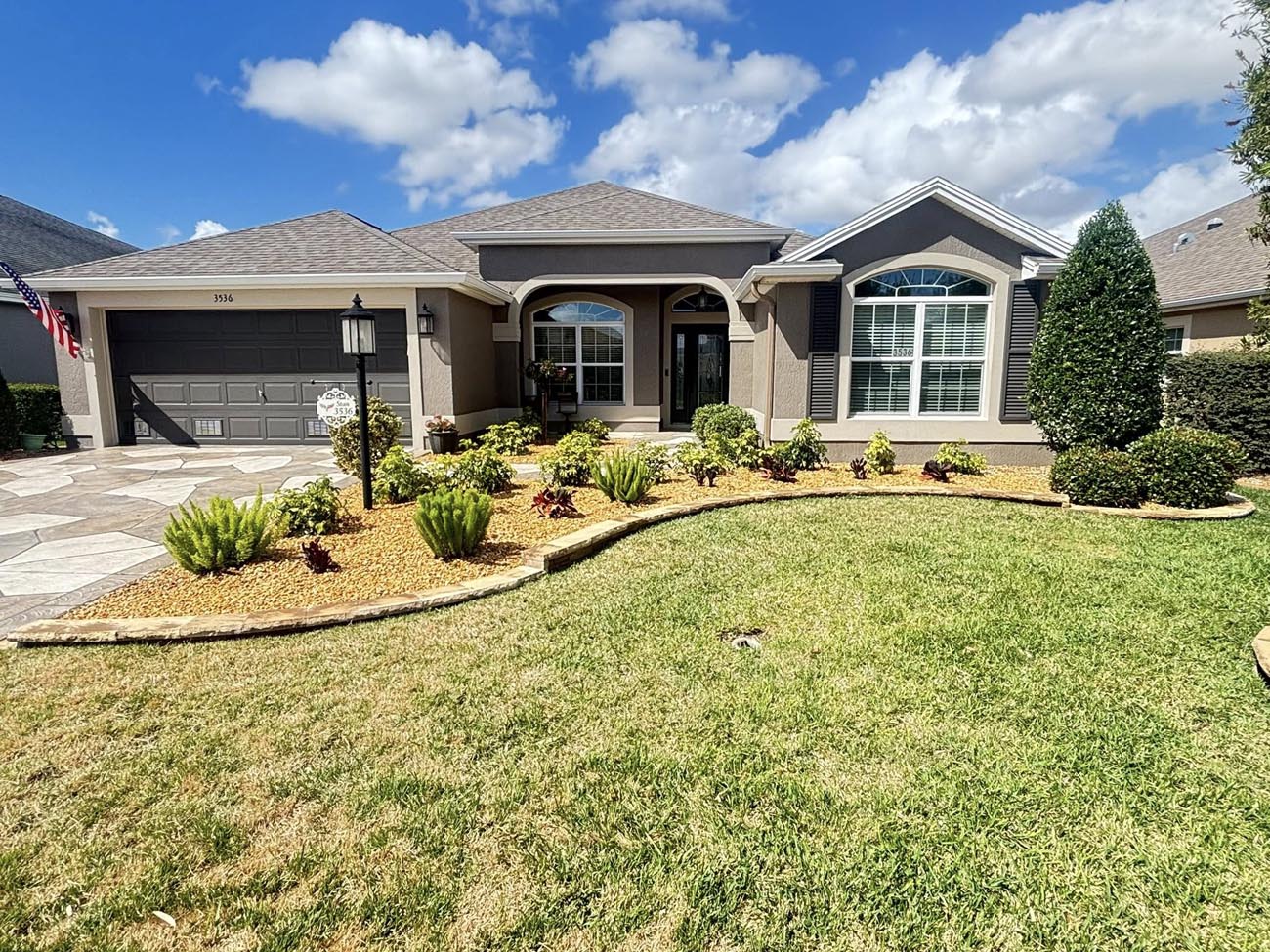 M.R. Quality Lawn Services crew on a job site in Summerfield