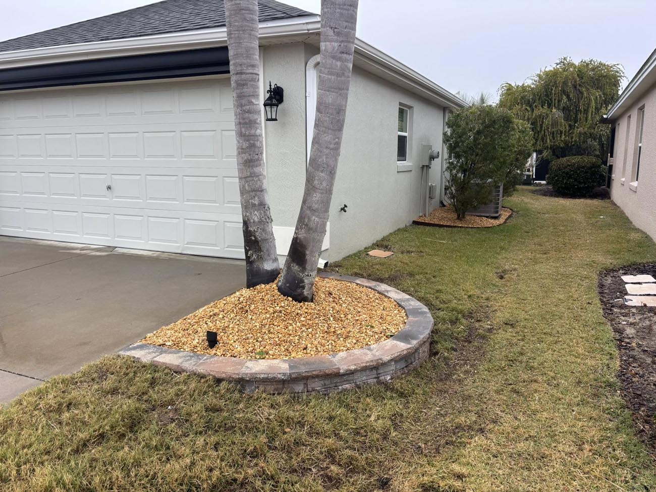 Decorative stone walkway and landscape border installation